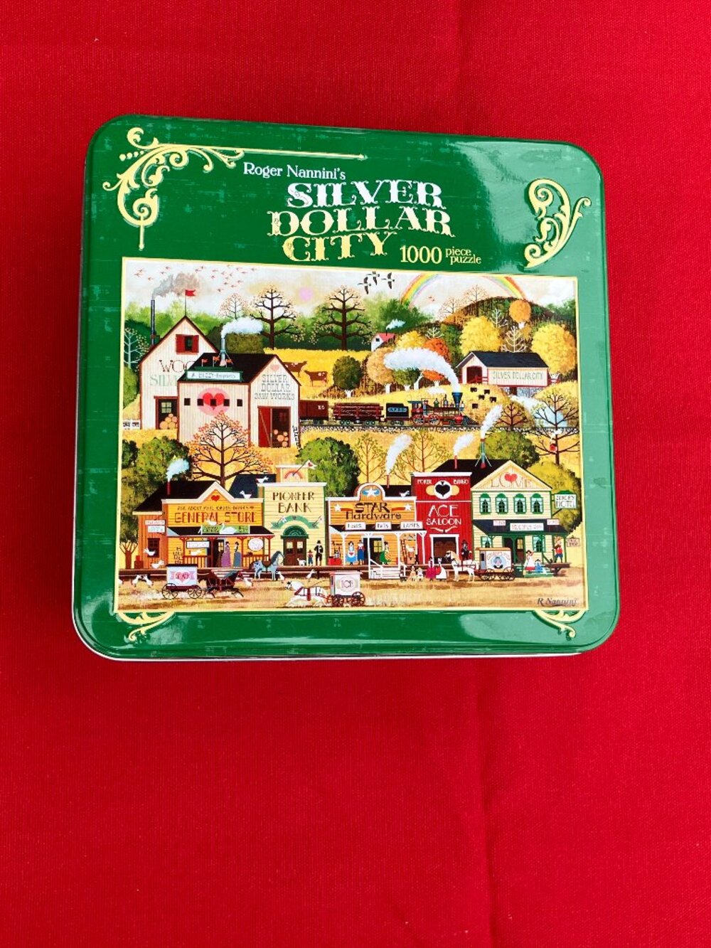 Ceaco 1000-piece puzzle - Silver Dollar city in a Tin Keepsake box